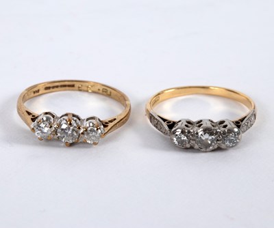 Lot 13 - A diamond three-stone ring set in 18ct yellow...