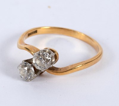 Lot 20 - A diamond crossover ring, set in platinum and...