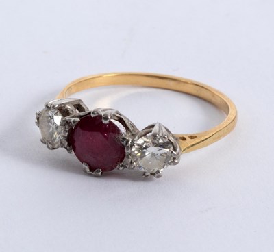 Lot 21 - A sapphire and diamond three-stone ring, claw...