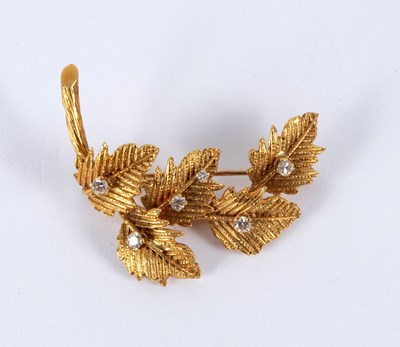 Lot 22 - An 18ct gold and diamond leaf spray brooch,...