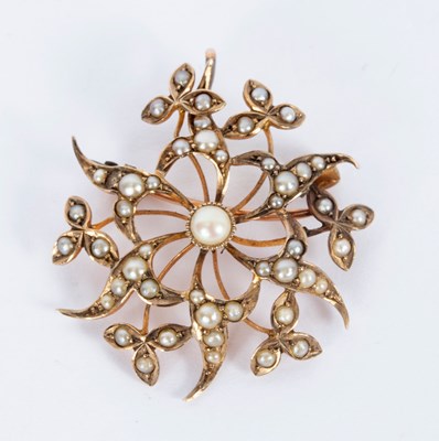 Lot 30 - An Edwardian pearl pendant brooch of openwork...
