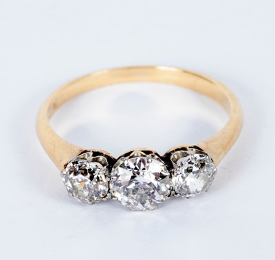 Lot 37 - A diamond three-stone ring, the central stone...