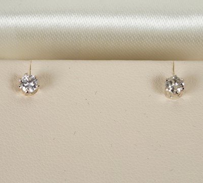 Lot 43 - A pair of diamond ear studs, each stone...