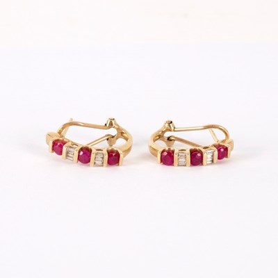 Lot 51 - A pair of ruby and diamond half hoop earrings,...