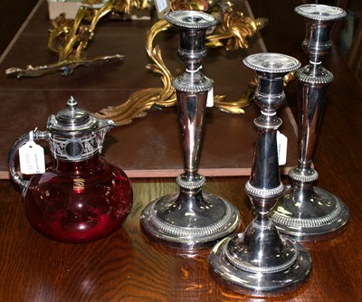 Lot 79 - Three plated candlesticks and a ruby tinted...