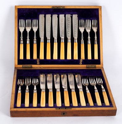 Lot 84 - A set of twelve silver plated fish knives and...