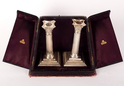 Lot 122 - A pair of silver candlesticks, Martin & Hall,...