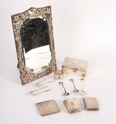 Lot 129 - A silver framed mirror, with shaped glass and...