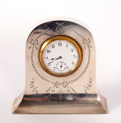 Lot 142 - An Edwardian silver cased bedside clock,...