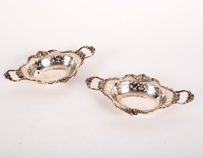 Lot 147 - A pair of small silver two-handled trays,...