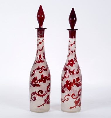 Lot 165 - A pair of ruby and clear glass decanters and...