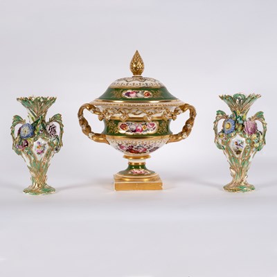 Lot 183 - A pair of two-handled vases encrusted with...