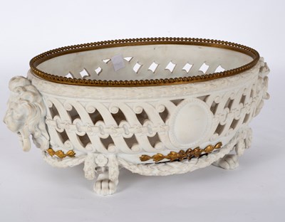 Lot 208 - A Continental biscuit porcelain and gilt metal...