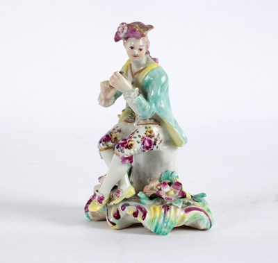 Lot 227 - A Derby figure of a seated musician, circa...