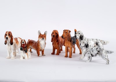 Lot 229 - Seven Royal Doulton figures of dogs, including...