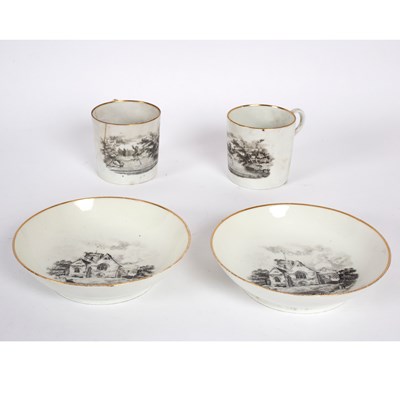 Lot 239 - Two English porcelain printed cans and saucers,...