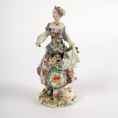 Lot 398 - A Chelsea figure of a shepherdess (red anchor),...