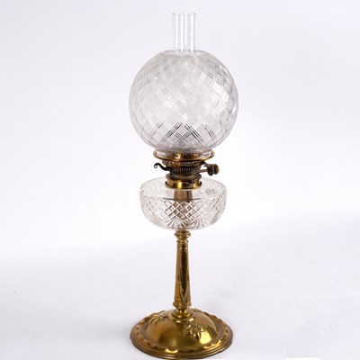 Lot 441 - A brass and glass oil lamp with funnel, shade...