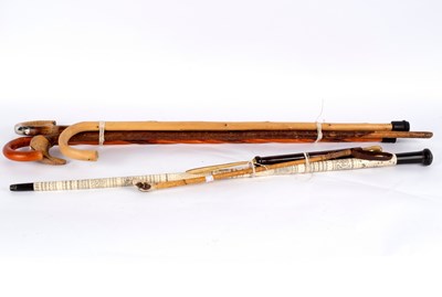 Lot 453 - A primitively carved ivory walking stick and...