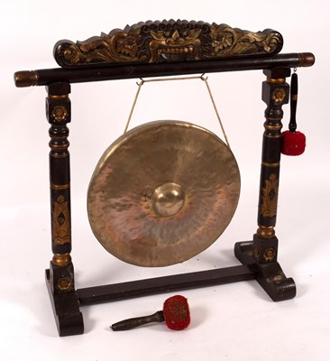 Lot 456 - A gong in a carved and gilded stand, 90cm wide