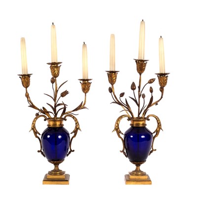 Lot 465 - A pair of blue glass and gilt metal mounted...