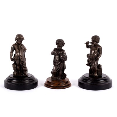 Lot 556 - Three bronze figures of putti, perhaps...