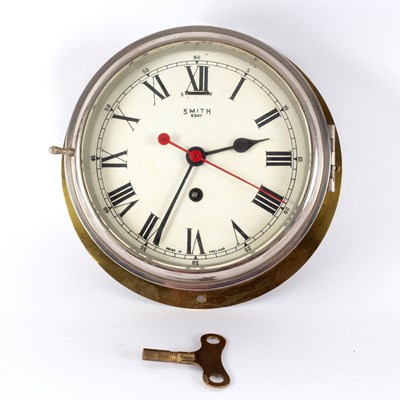 Lot 567 - A ships brass cased eight-day clock by Smith,...