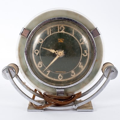 Lot 569 - An Art Deco mantel clock by Smith, in a chrome...