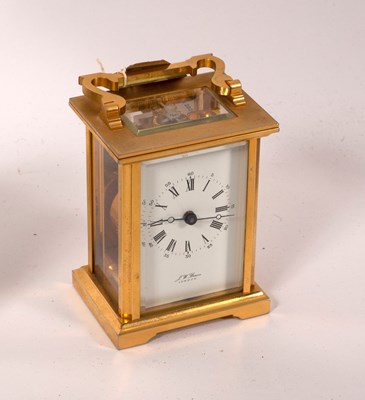 Lot 577 - A gilt brass cased carriage clock, the white...