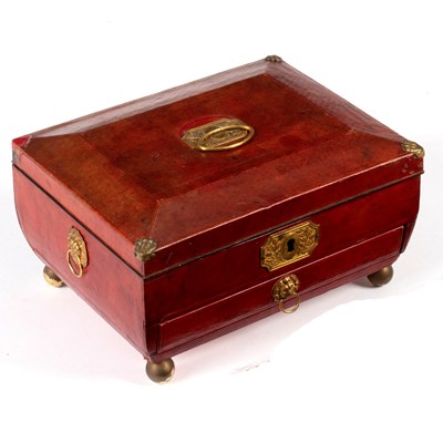 Lot 658 - A Regency red leather jewel box of sarcophagus...