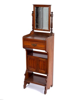 Lot 718 - An Edwardian walnut shaving stand with mirror...