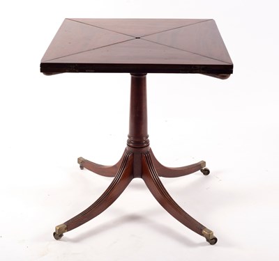 Lot 757 - An Edwardian mahogany envelope card table on...