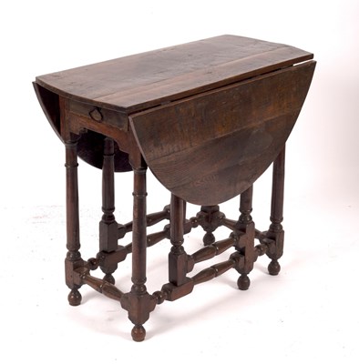 Lot 760 - An oak two-flap oval gateleg table, fitted a...