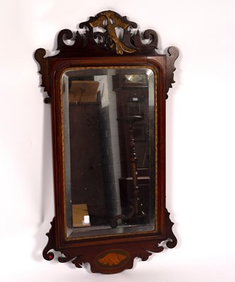 Lot 762 - A mahogany wall mirror, the frame with gilded...