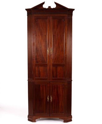 Lot 764 - A mahogany corner cupboard with broken dentil...