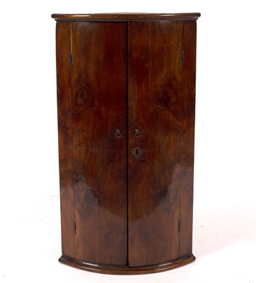 Lot 779 - An 18th Century walnut bowfront corner...