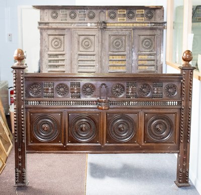 Lot 806 - A 19th Century oak bed, the headboard with...