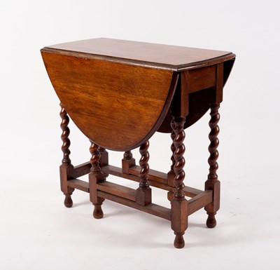 Lot 823 - A small oak gateleg table on barley twist legs,...