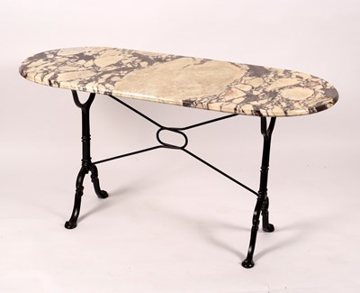 Lot 853 - A marble top table on cast iron end supports,...