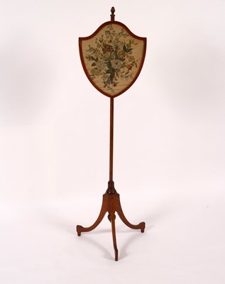 Lot 862 - A satinwood pole screen, the shield-shaped...