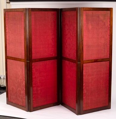 Lot 864 - A mahogany framed four-panel folding screen...