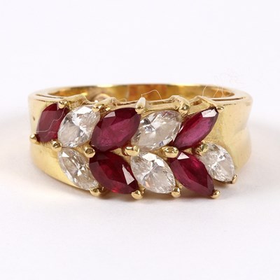 Lot 56 - A ruby and diamond dress ring, the stones of...