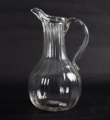 Lot 105 - An 18th Century French wine ewer with wrythen...
