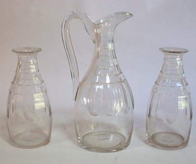 Lot 138 - A cut glass ewer and two carafes/Note:...