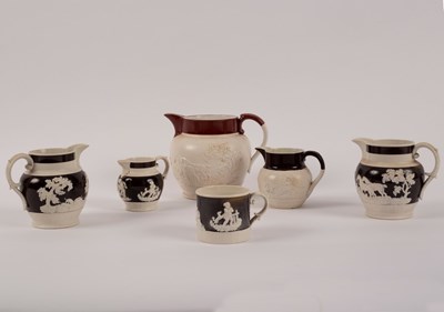 Lot 178 - Four 19th Century jugs with raised decoration...