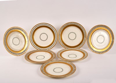 Lot 181 - Seven Minton plates with gilt borders and...