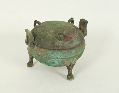 Lot 230 - A Chinese bronze ding, Han dynasty, the domed...