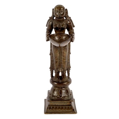 Lot 233 - An Indian bronze oil lamp figure, Lakshmi,...