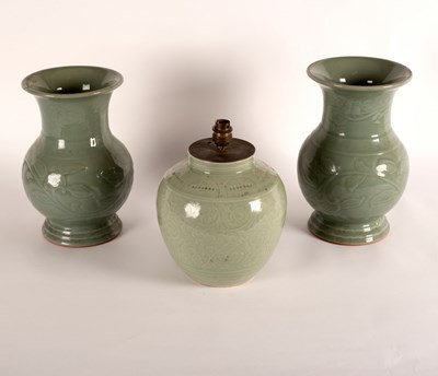 Lot 252 - A near pair of Chinese celadon baluster vases,...