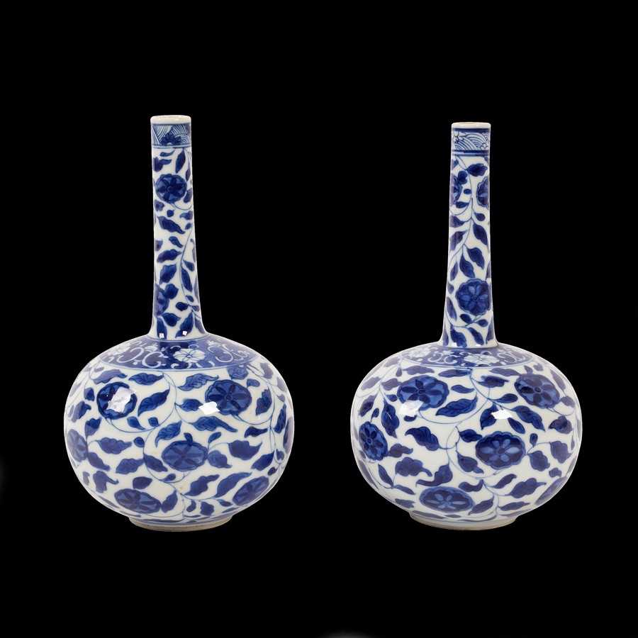 Lot 254 - A pair of Chinese blue and white floral bottle...